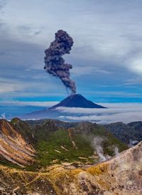 Scenic view of volcanic landscape against sky