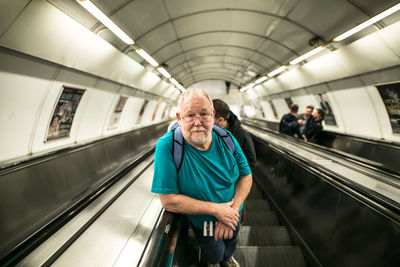 Rear view of man on train at subway station