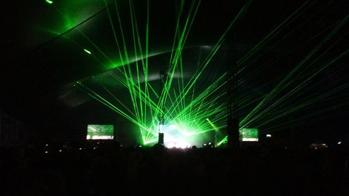 Low angle view of illuminated lights at night