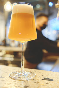 Elegant glass of craft beer and taps. beer taps in a row in perspective. selective focus.