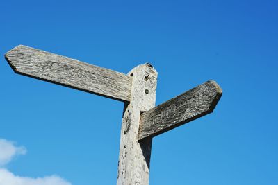 Low angle view of statue against blue sky