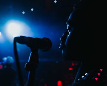 Blurred motion of people enjoying music concert