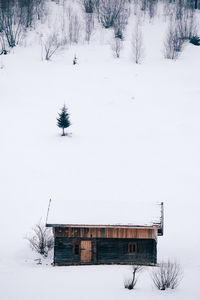 Snow covered landscape against clear sky