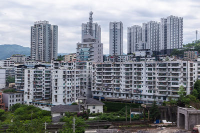 Modern buildings in city against sky