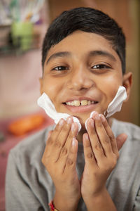 Close-up portrait of a smiling teenage girl