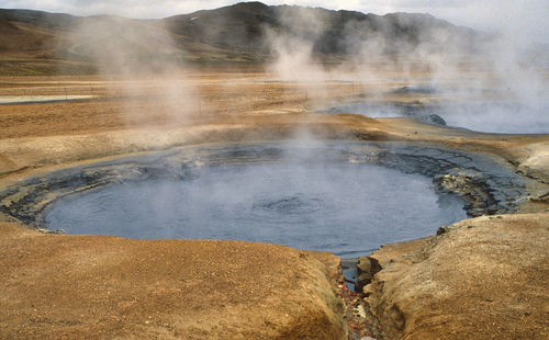 Smoke emitting from volcanic mountain