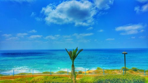 Scenic view of sea against cloudy sky