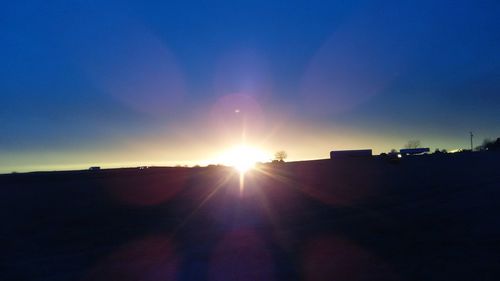 Silhouette landscape against sky during sunset