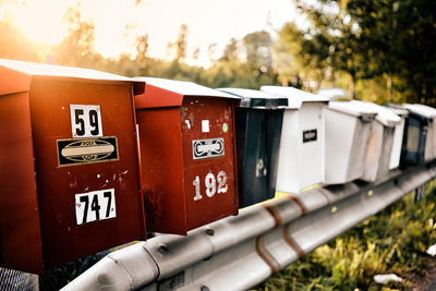 Close-up of post boxes in sweden against the sky