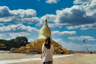 Rear view of a woman walking in temple