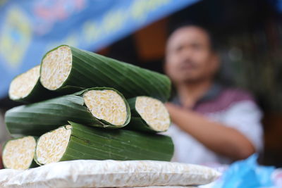 Close-up of food wrapped in banana leaves in market