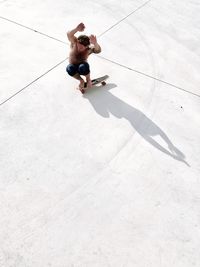 High angle view of man skateboarding on street