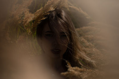 Portrait of young woman sitting outdoors