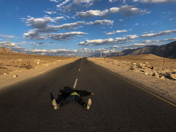 View of horse on road against sky