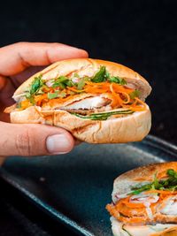 Cropped hand of person having food