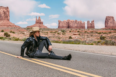 Man sitting on road