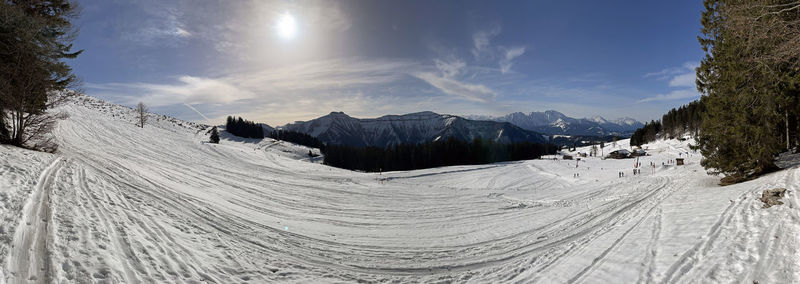 Scenic view of snowcapped mountains against sky