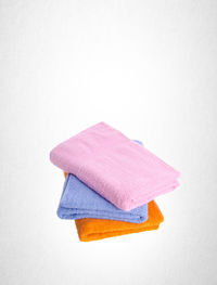 Stack of towels over white background