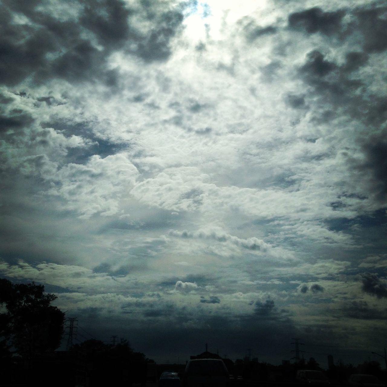 sky, cloud - sky, cloudy, silhouette, building exterior, built structure, low angle view, architecture, tree, weather, cloud, overcast, dusk, nature, city, storm cloud, outdoors, no people, cloudscape, beauty in nature