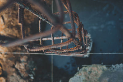 Close-up of rusty chain on wall