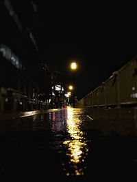 View of illuminated street lights at night