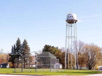 Tower on field against clear sky