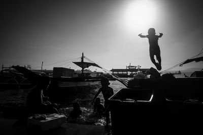 Full length of woman standing on railing