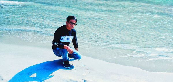 Full length of man standing on beach