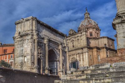 Low angle view of cathedral against cloudy sky