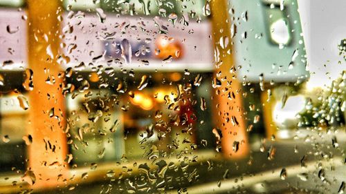 Full frame shot of wet glass window in rainy season