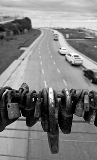 High angle view of padlocks on railing