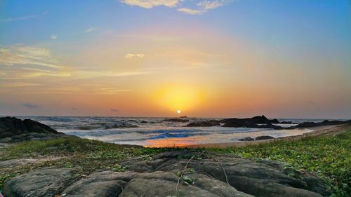 Scenic view of sea at sunset