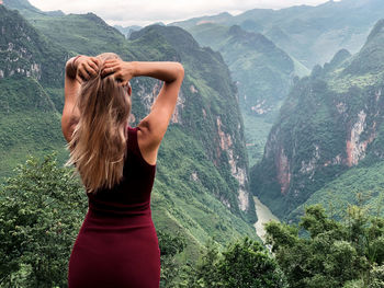Woman standing in mountains