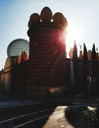 Low angle view of illuminated building against sky