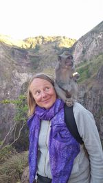 Portrait of woman against mountains