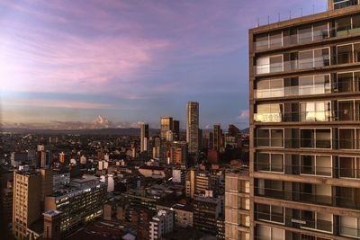 Cityscape against sky at sunset