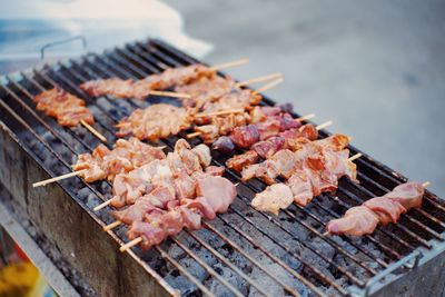 High angle view of meat on barbecue grill