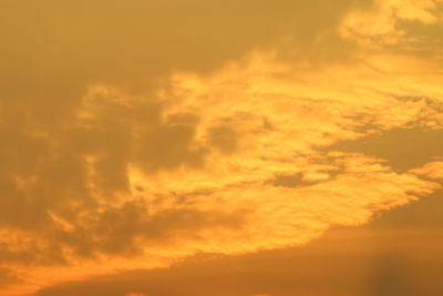 Low angle view of dramatic sky during sunset