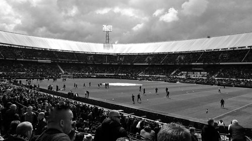 Crowd at stadium against sky