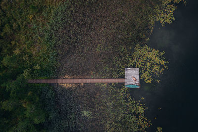 Drone shot of the wooden pier and a lake in mazury, poland.