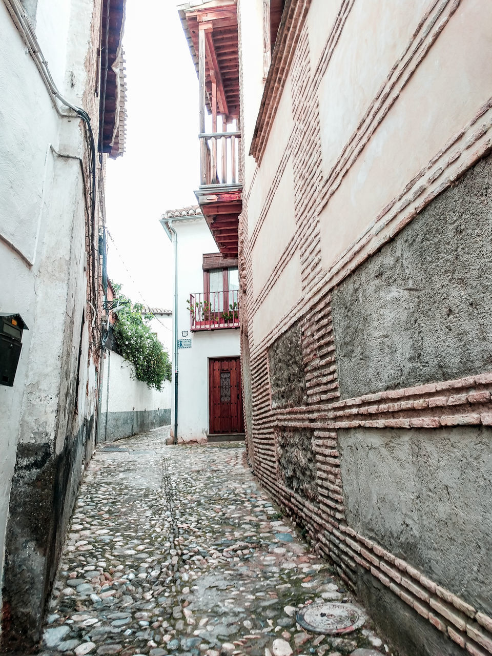 NARROW STREET AMIDST BUILDINGS