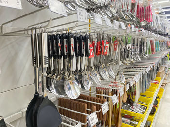 Row of clothes hanging in rack for sale