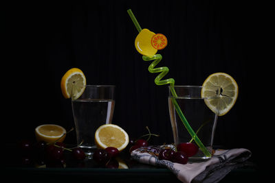 Glass of fruits on table