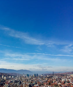 High angle view of townscape against blue sky
