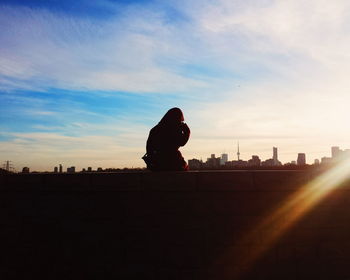 Silhouette of people at sunset
