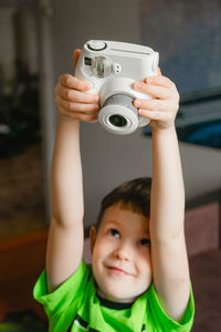 Close-up of woman photographing with camera