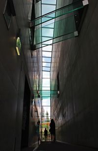 People walking in corridor of building