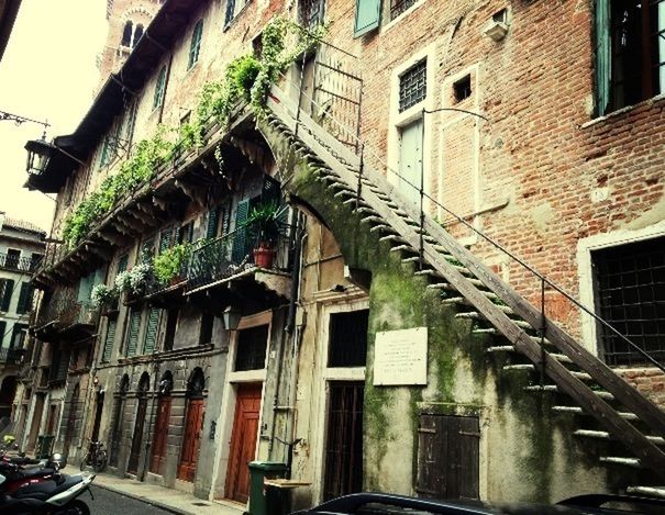 architecture, built structure, building exterior, window, residential building, building, residential structure, arch, low angle view, city, old, balcony, house, old town, street, facade, day, alley, outdoors, no people