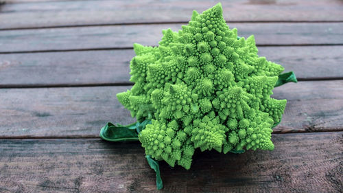 Romanesco cabbage on a wooden background. delicious fresh vegetables grown in an organic garden. 