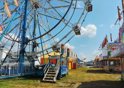 Low angle view of ferris wheel against sky